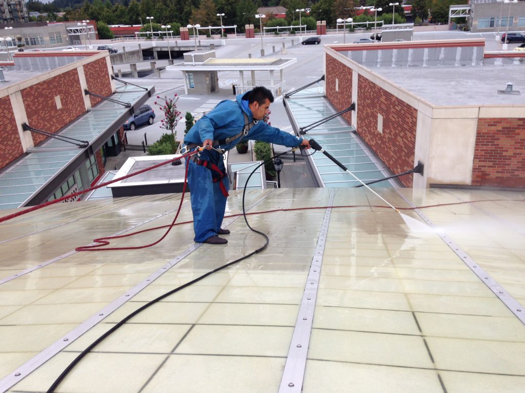 Pressure Washing Roof Top, Building & Sidewalks